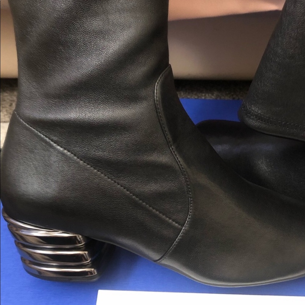 Beautiful over the née boots. Run Half Size Big.